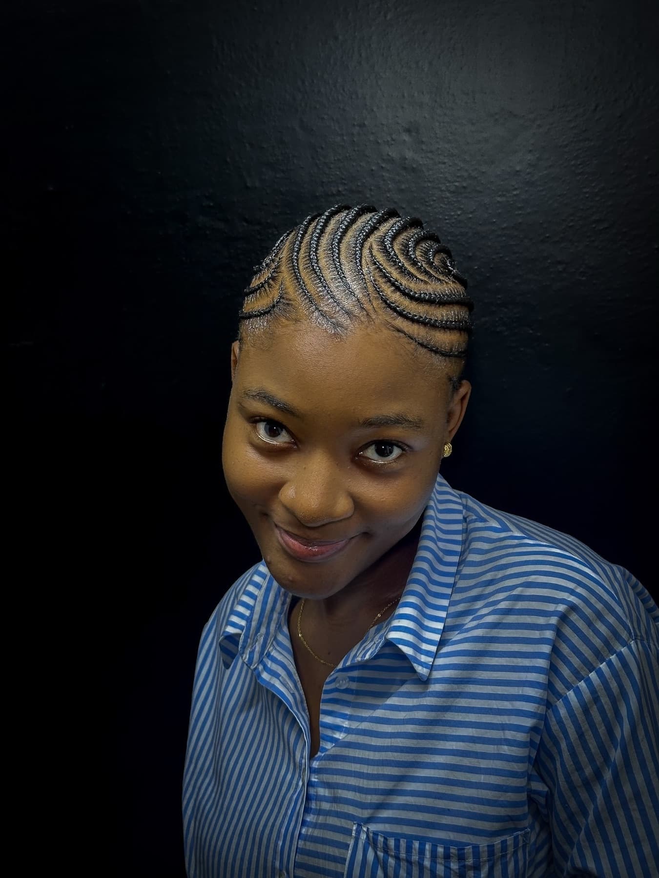 Detailed spiral cornrow pattern